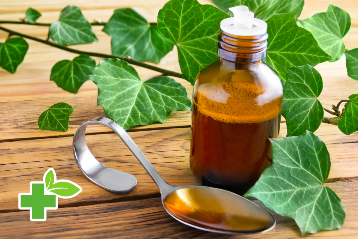 Bouteille de sirop naturel et feuilles de lierre, remède efficace contre la toux persistante.